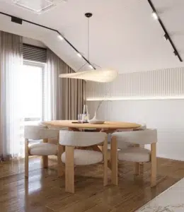 PROJEKTY 14 Nowoczesna jadalnia z okrągłym stołem i designerskimi krzesłami w jasnym, minimalistycznym wnętrzu kuchni