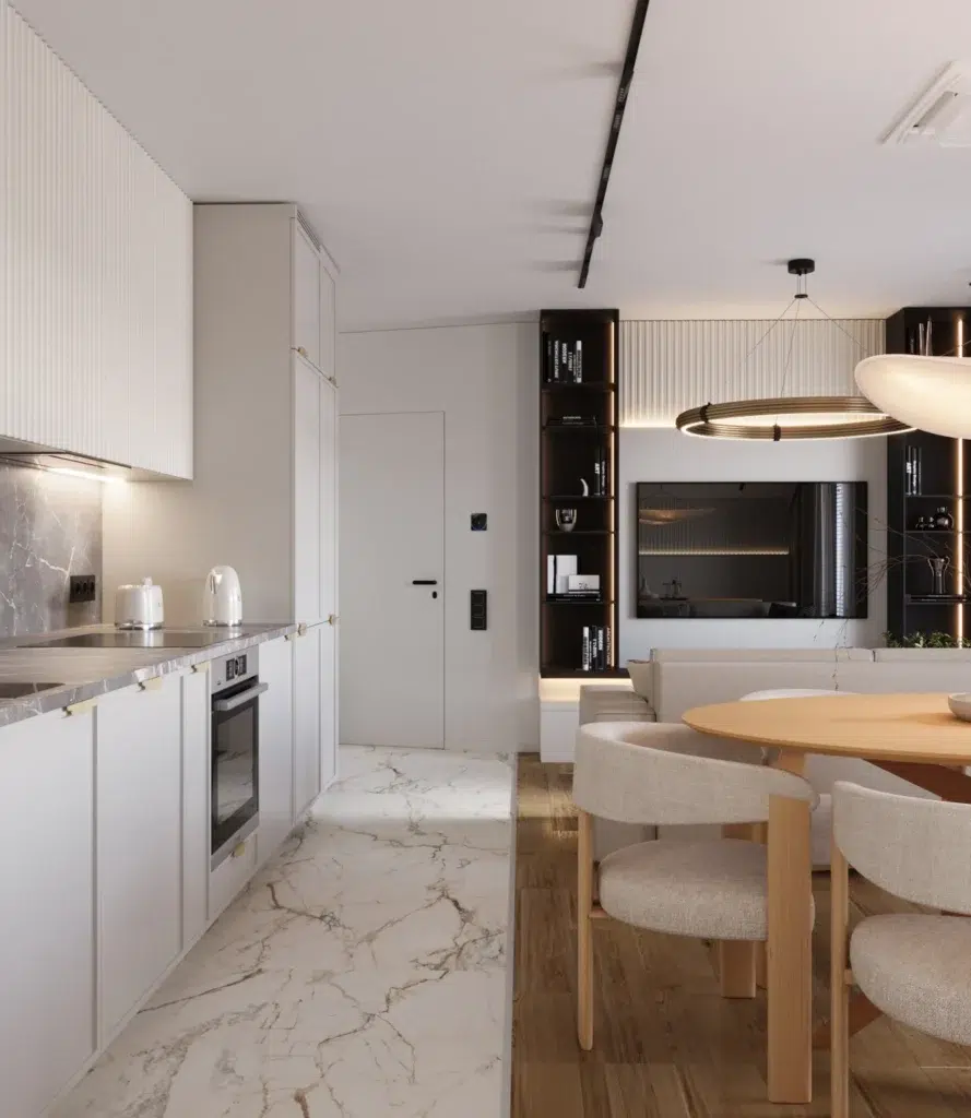 Nowoczesna jadalnia z okrągłym stołem i designerskimi krzesłami w jasnym, minimalistycznym wnętrzu kuchni